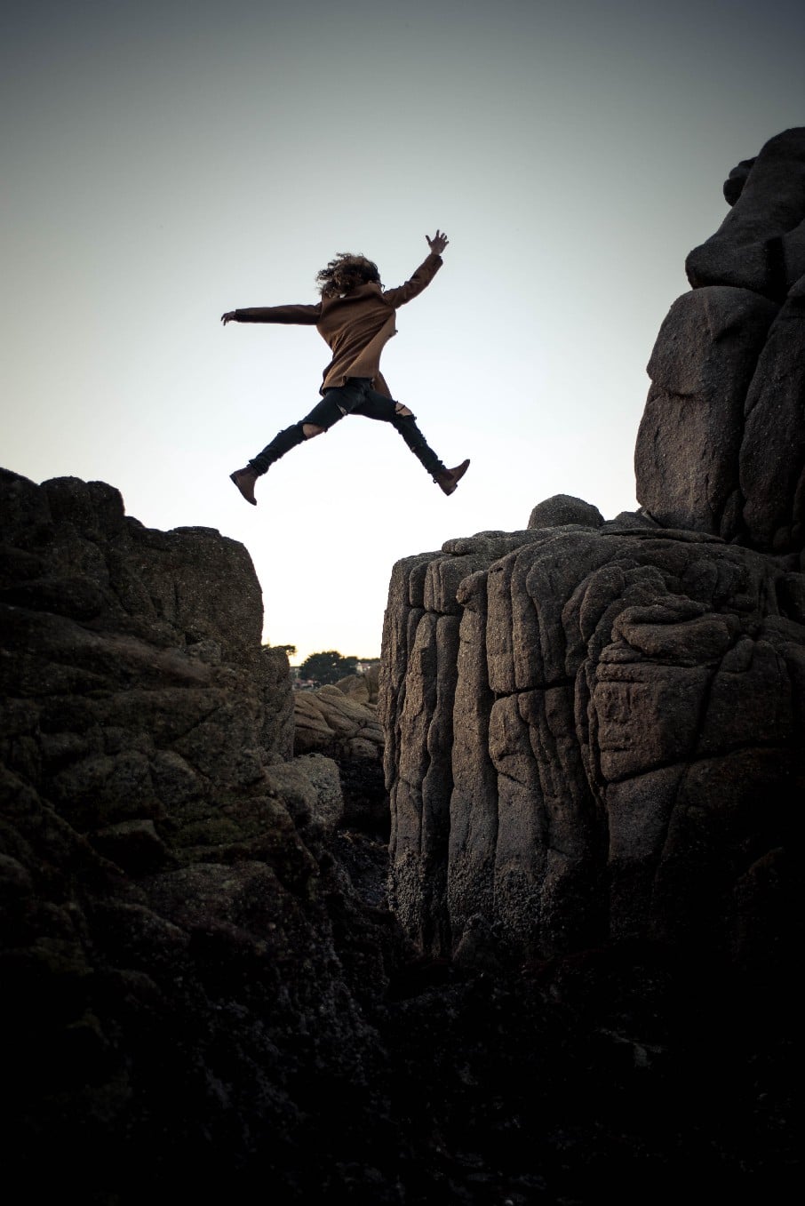 Person jumping a chasm